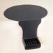 A black Cal-Mil Drip Minder tray on a table.