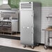 A stainless steel True Spec Series reach-in refrigerator with a white door handle.