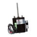 A close-up of a black and silver Kolpak motor with wires and a cord attached.
