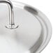 A Vollrath stainless steel pot cover with a loop handle.