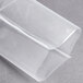 A clear plastic wrapper of ARY VacMaster chamber vacuum packaging pouches on a grey surface.