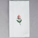 A white Hoffmaster guest towel with a floral design.