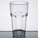 A close-up of a clear Carlisle plastic tumbler.