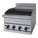 A Garland stainless steel natural gas charbroiler with ceramic briquettes.