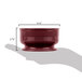 A hand holding a Cambro Shoreline Collection cranberry bowl.