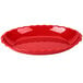 a red bowl with wavy edge