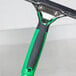 A green and black Unger ErgoTec XL squeegee handle.