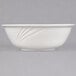 A CAC white porcelain bowl with a wavy design.