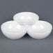 A CAC super white three bowl tasting dish with three bowls stacked on top of each other.