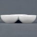 A white CAC three bowl tasting dish sitting on top of another white CAC three bowl tasting dish.