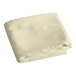 A folded ivory Intedge 100% polyester table cover.