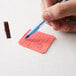 close-up of a person holding a pen