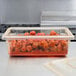 A yellow Cambro food storage container on a counter.