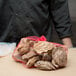 A table with a Royal Paper red mesh bag of oysters.