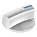 A silver Imperial Range open burner knob with a blue stripe.