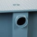 A metal box with a round hole in it.