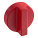 A close-up of a red plastic Vulcan gas valve knob.