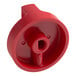 A red plastic Vulcan gas valve knob with a hole.