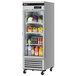 A Turbo Air glass door reach-in refrigerator in a school kitchen full of food on the shelves.