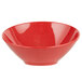 A red bowl with a speckled surface.