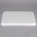 A white foam CKF meat tray with text on it.