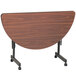A Correll walnut melamine half round table on wheels.