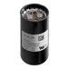 A close-up of a black Manitowoc Ice start capacitor.
