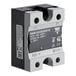 A black and white electrical device with a small circuit breaker inside.