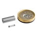 A metal cylinder with a round metal object and metal tube attached.