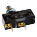 A Blodgett 5906 door switch assembly with metal terminals and a push-button actuator.