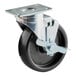 A black 5" caster wheel with a silver metal plate.