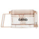 A clear plastic Waring grinding bowl with a black handle and clear lid.