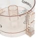 A clear plastic container and lid with a black circular label.