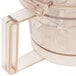 A clear plastic Waring grinding bowl with a clear plastic lid.