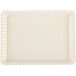 A white rectangular tray with scalloped edges.