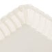A white rectangular tray with a scalloped edge.