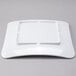 A white square GET Milano melamine plate.