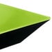 A green square melamine bowl with black trim.