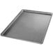 A close-up of a Chicago Metallic aluminized steel bun pan with a silver finish.