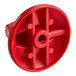 A red plastic Vulcan Hart control knob with holes.