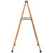 An Aarco oak A-Frame sign board with black marker board on a wooden easel with metal legs.