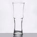 A close-up of a Libbey Napoli Grande cocktail glass with a curved rim and single stem.