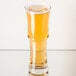 A Libbey Napoli cocktail glass filled with a drink on a table.