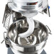 A Vollrath commercial floor mixer with a white dough hook inside.