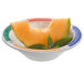 A piece of melon in a colorful GET Diamond Barcelona bowl.