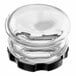 A clear glass container with a black plastic cap.