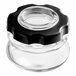 A clear glass jar with a black lid.