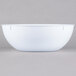 A white bowl with a white border on a white background.