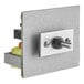 A metal square with a silver and black metal switch.