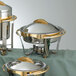 close-up of a silver and gold chafing dish